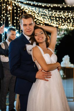 newlyweds at a wedding in the corridor of sparklers