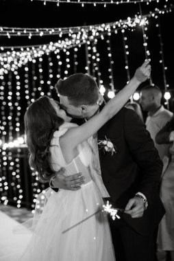 newlyweds at a wedding in the corridor of sparklers
