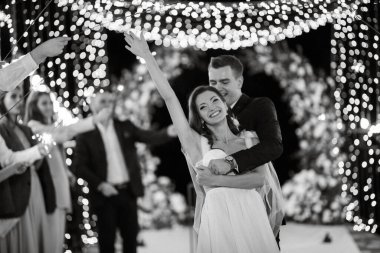 newlyweds at a wedding in the corridor of sparklers