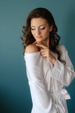 morning of the bride with the creation of the image of makeup and the creation of hairstyles