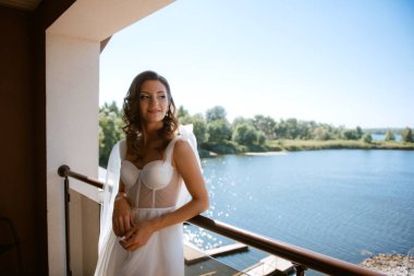 morning of the bride with the creation of the image of makeup and the creation of hairstyles