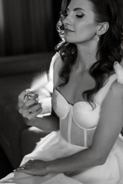 morning of the bride with the creation of the image of makeup and the creation of hairstyles