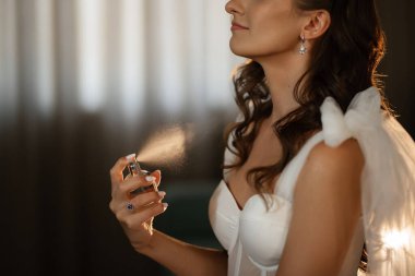 morning of the bride with the creation of the image of makeup and the creation of hairstyles