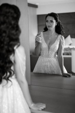 morning of the bride with the creation of the image of makeup and the creation of hairstyles