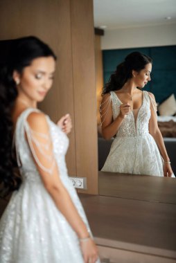 morning of the bride with the creation of the image of makeup and the creation of hairstyles