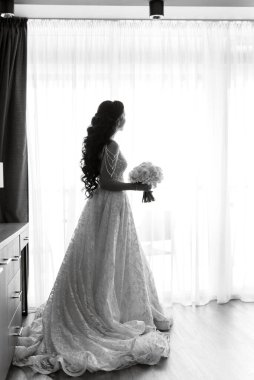 morning of the bride with the creation of the image of makeup and the creation of hairstyles