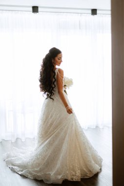 morning of the bride with the creation of the image of makeup and the creation of hairstyles