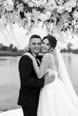 wedding ceremony of the newlyweds on the pier near the restaurant
