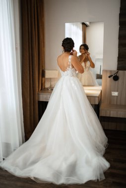 bride in a white dress at the training camp inside the hotel
