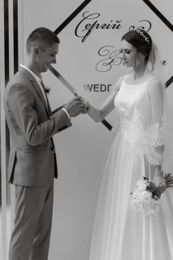 wedding ceremony of the newlyweds on the glade near the restaurant