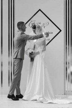 wedding ceremony of the newlyweds on the glade near the restaurant