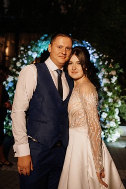 newlyweds at a wedding in the corridor of sparklers