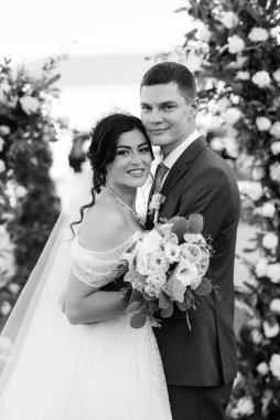 wedding ceremony of the newlyweds on the glade near the restaurant