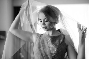 bride in a white dress at the training camp inside the hotel