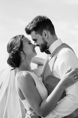 bride blonde girl and groom near the river at sunset light