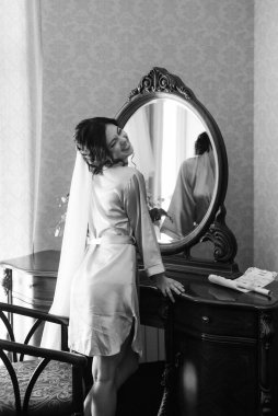 morning of the bride with the creation of the image of makeup and the creation of hairstyles