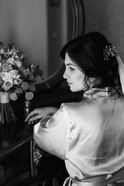 morning of the bride with the creation of the image of makeup and the creation of hairstyles