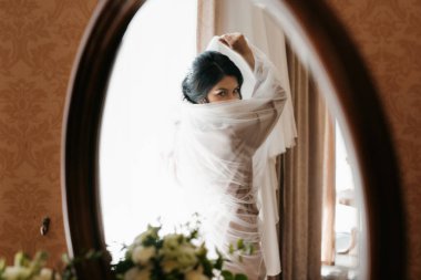 morning of the bride with the creation of the image of makeup and the creation of hairstyles