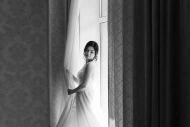 morning of the bride with the creation of the image of makeup and the creation of hairstyles