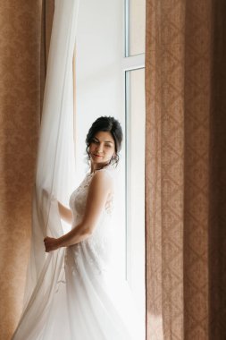 morning of the bride with the creation of the image of makeup and the creation of hairstyles