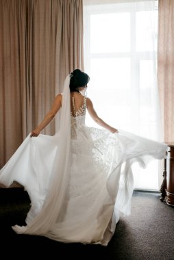 morning of the bride with the creation of the image of makeup and the creation of hairstyles