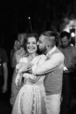 newlyweds at a wedding in the corridor of sparklers