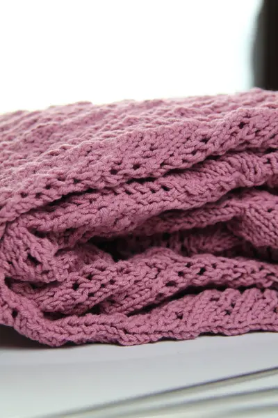 El yapımı katlanmış süveter. Giysi dokusu