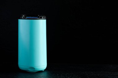 Electronic Mosquito Repellent Machine on Dark Background Horizontal