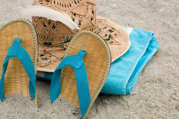Blue Towel Sandals Straw Hat Sand Horizontal — Stock Photo, Image