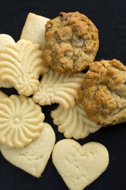 Macro Image of Delicious Shortbread and Raisins Cookies on Dark Background Vertical clipart