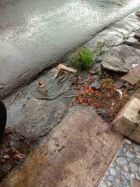 roadside ditch flooded with rainwater