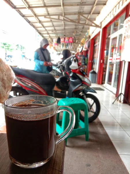 a cup of black coffee at the table