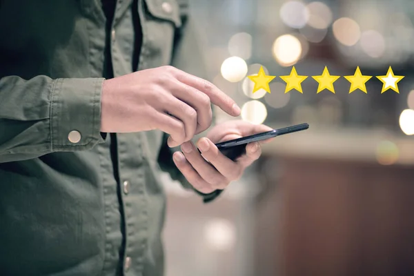 Estimated Gold Stars Concept Evaluation Services Man Tapping Phone Screen Stock Image