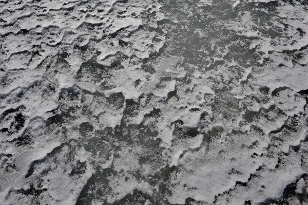 stock image Monochrome patterns in surface of frozen lake.