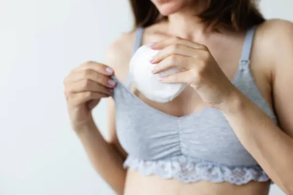 Woman Putting Bra Absorbent Pad Selective Focus Royalty Free Stock Images