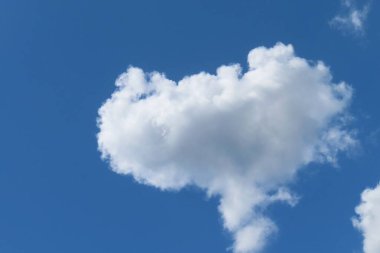 Big heart shape cloud in blue sky, natural background
