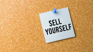 Sell Yourself sign on corkboard. clipart