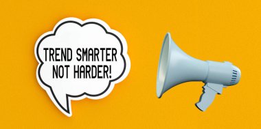 Trend Smarter, Not Harder! text message on speech bubble.Megaphone and announcement concept,yellow background. clipart