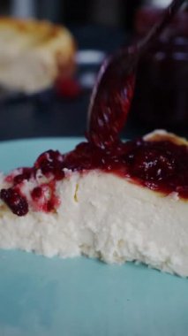 Cheesecake with strawberry jam, closeup fhd footage