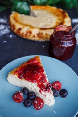Cheesecake slice with strawberry jam, overhead view High quality photo