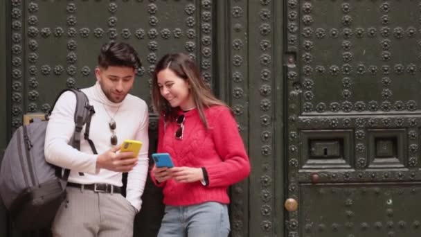 Two Friends Watching Memes Cellphones Laughing Wall Copy Space High — Stock Video