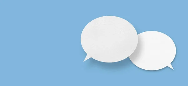 White Paper Speech Bubbles Isolated Blue Background Communication Bubbles Design — стоковое фото