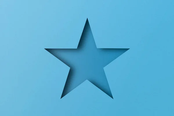 Светло Голубая Бумага Разрезанная Отверстия Звезды Покрыты Светом Тенью — стоковое фото