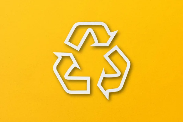 White Paper Cut Recycled Shapes Isolated Yellow Paper Background — Stock Fotó