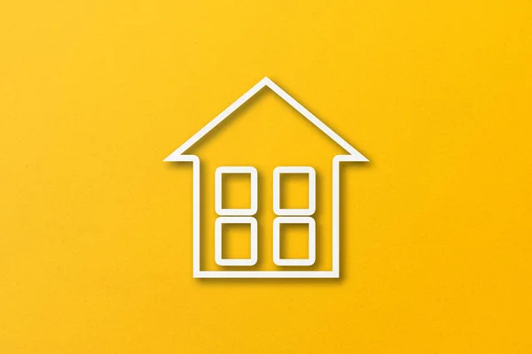 White Paper Cut Out House Shape Isolated Yellow Paper Background — стоковое фото