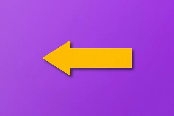 Yellow Paper Arrow Isolated Purple Paper Background — Foto Stock