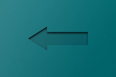 Yeşil kağıt bir ok şeklinde yumruklanmış. üstüste kağıt