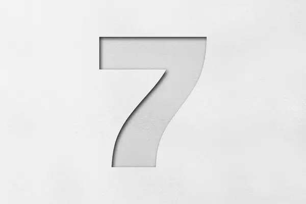 White paper font number 7 isolated on white background.