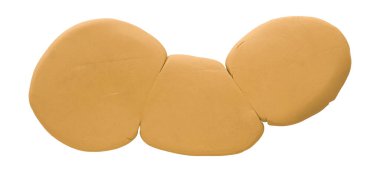 Plastik, beyaz arka planda izole edilmiş turuncu bir fırçadır..