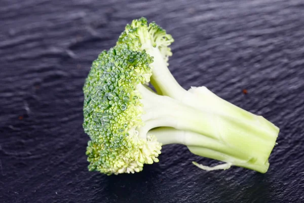 Broccoli isolated isolation on the black SLATE